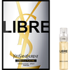 A box of Yves Saint Laurent Libre L'Absolu Platine perfume alongside a small spray bottle of the same fragrance. The box features bold black and gold lettering.