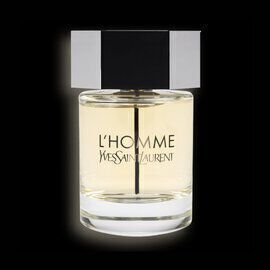 A clear glass bottle of L'Homme Yves Saint Laurent perfume, featuring a sleek design and a black cap, against a dark background.