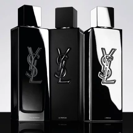 Trois flacons de parfum YSL noirs sur fond clair