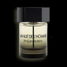 A sleek glass bottle of "La Nuit de L'Homme" perfume by Yves Saint Laurent, set against a black background. The bottle features a dark cap and a minimalist design.