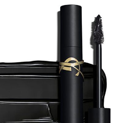 A sleek black mascara tube with a gold accent and a mascara wand, set against a clean white background.