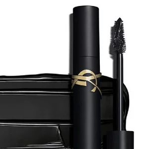 A sleek black mascara tube with a gold accent and a mascara wand, set against a clean white background.