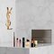 Coffret beaute YSL avec mini-produits et trousse.