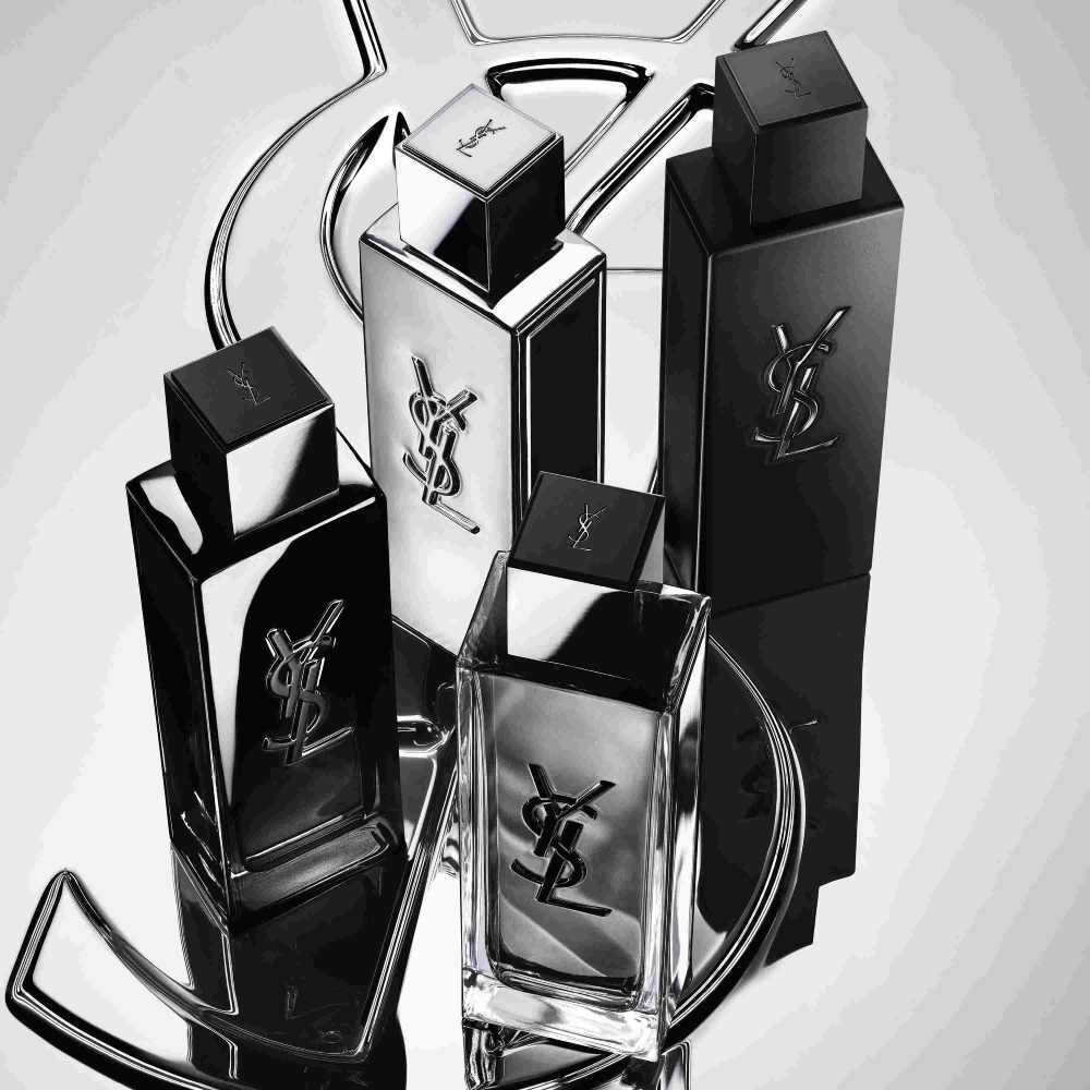 Quatre flacons de parfum YSL noirs et argentes