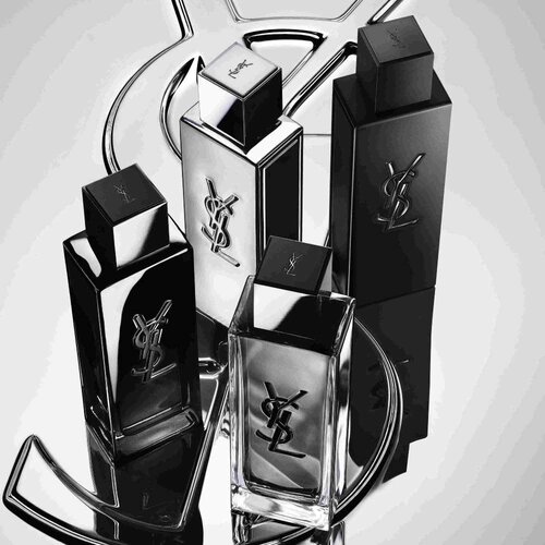 Quatre flacons de parfum YSL noirs et argentes