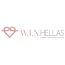 Logo "W.I.N. HELLAS" avec un symbole d'infini rose clair et un coeur, dans un cercle blanc.