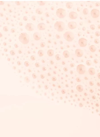 Une texture douce et pastel composee de motifs circulaires en relief sur un fond clair.