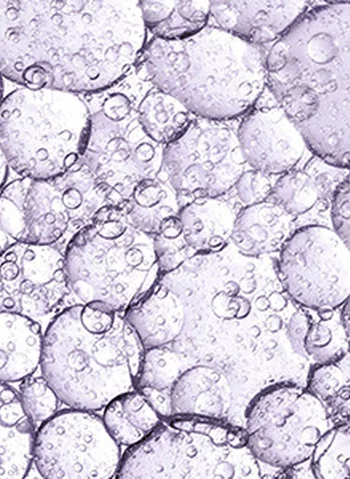 Bulles d'air dans un fond violet avec des reflets translucides.