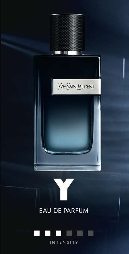 A sleek, modern perfume bottle from Yves Saint Laurent, featuring a dark blue gradient and a silver label that reads "Y" and "Eau de Parfum," set against a dark background with a gradient effect.