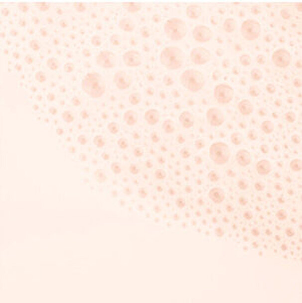 Une texture delicate avec des cercles de differentes tailles sur un fond pastel.