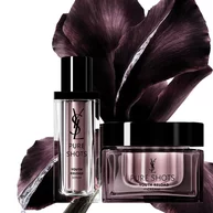 Two purple skincare products with dark flower petals